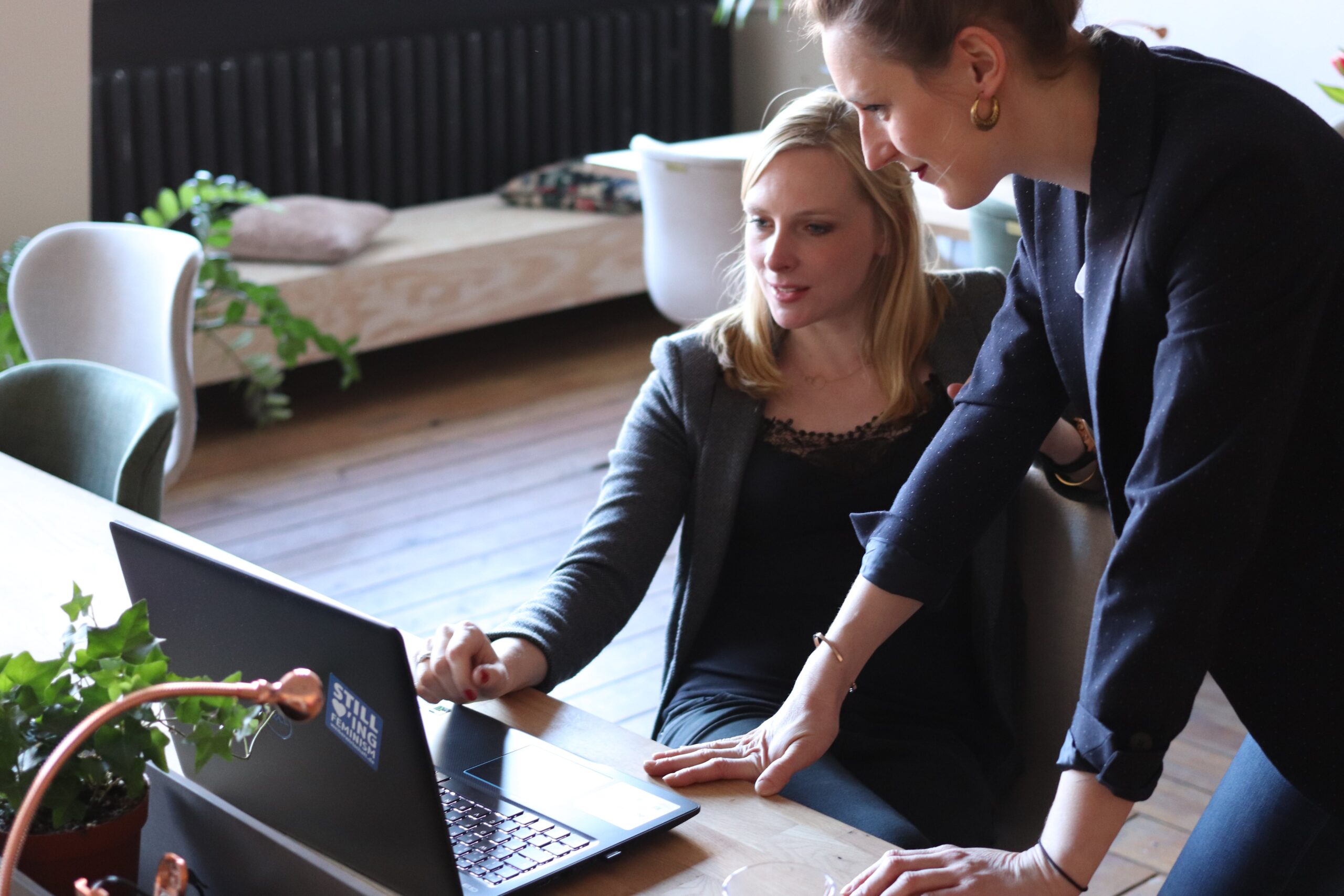 The 10 Essential Elements of a Successful Press Release 2 Two people looking at a computer of a successful press release