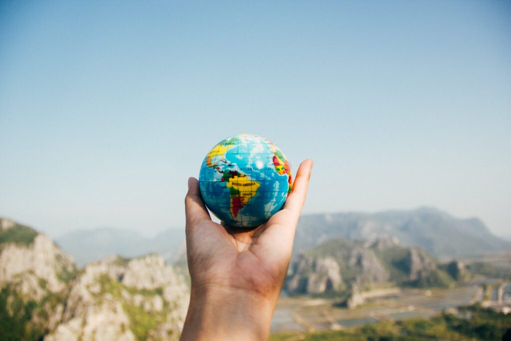 Global PR - an image of a persons hand holding a globe.