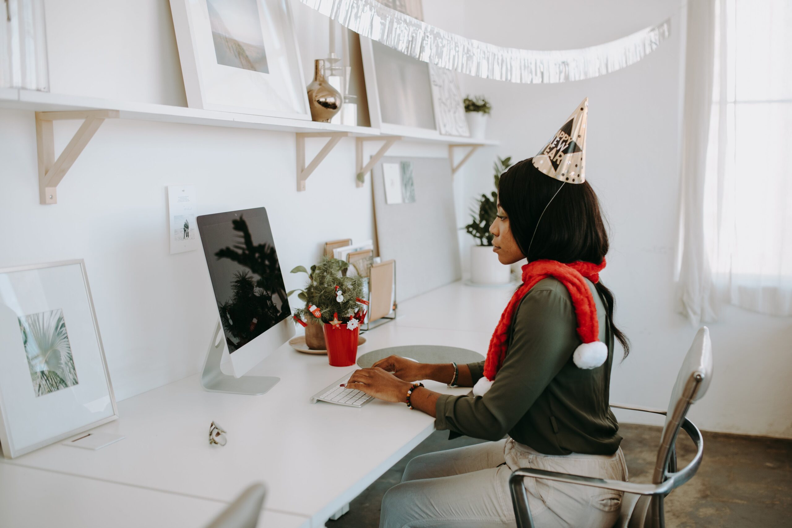 Master the Christmas Press Release: Top Tips for Holiday News 2 a person sat at a desk writing a Christmas press release