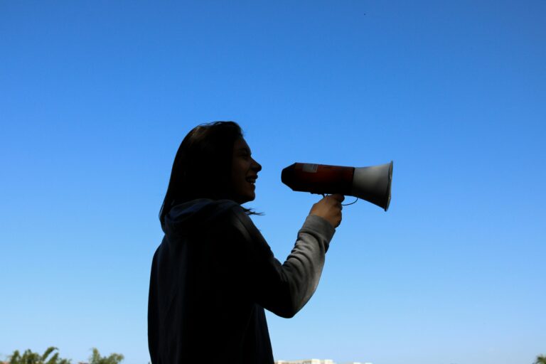 a person holding a megaphone showing CTA