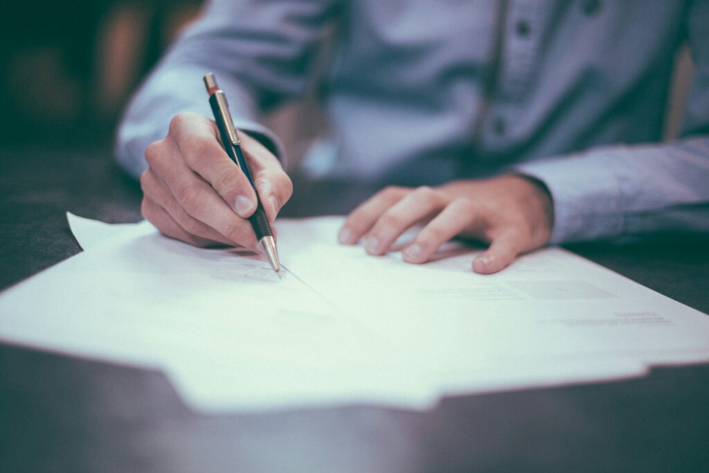 PR Fire's Finance Press Release Service - a person writing